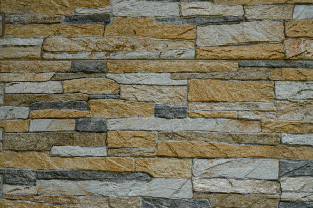istock Natural stone wall with a blend of earthy tones and textures creating a rustic aesthetic 2198950803