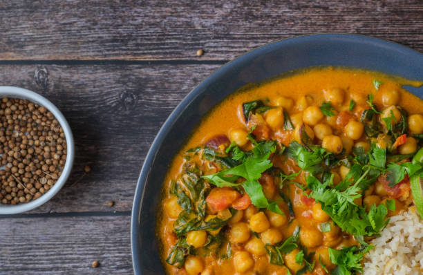 istock Vegan Chickpea curry against a wooden background. 2198951072