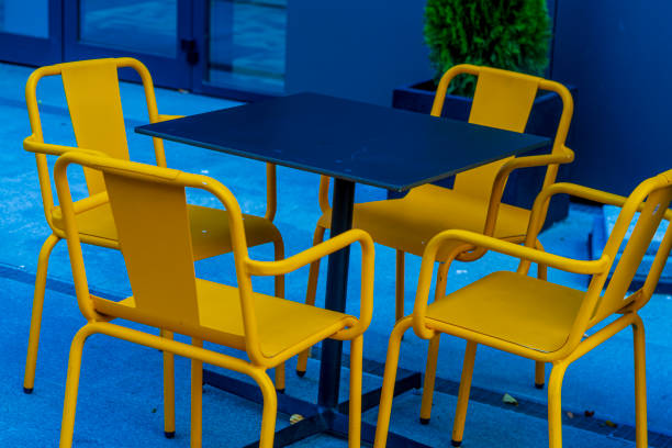 Empty table at restaurant terrace. Exterior table and chairs