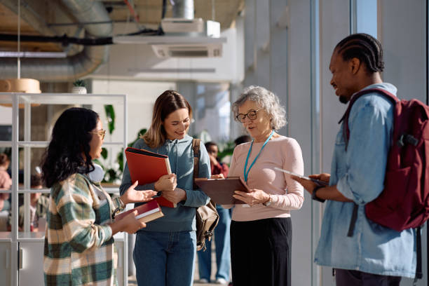 istock Mature professor having consultations with her students at the university. 2198962181