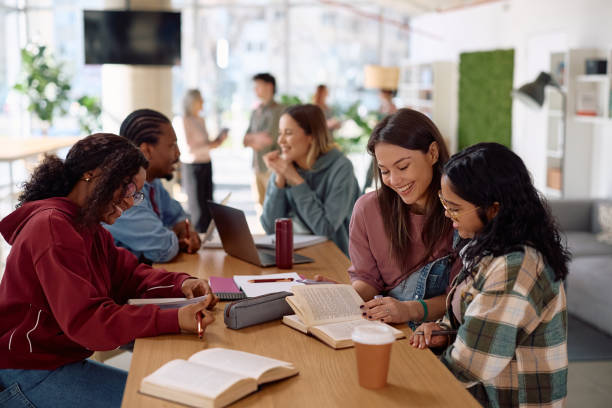 istock Multiracial group of college students cooperating while studying together. 2198962197