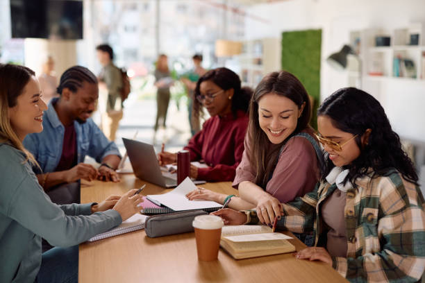 istock Happy student learning with her friends at the university. 2198962200
