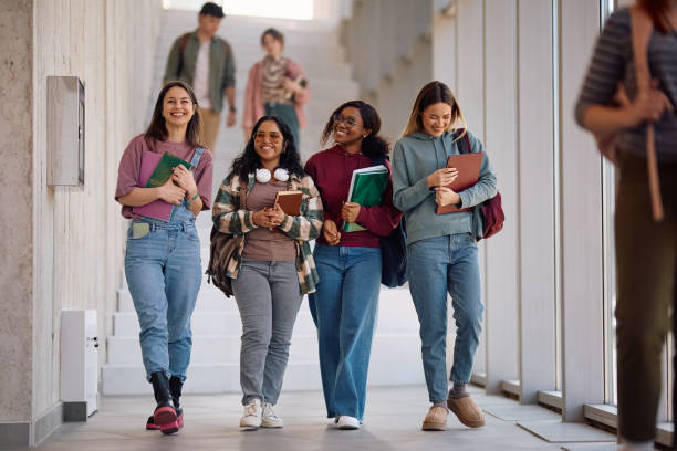 istock Multiracial group of happy students going on a lecture at the university. 2198962244
