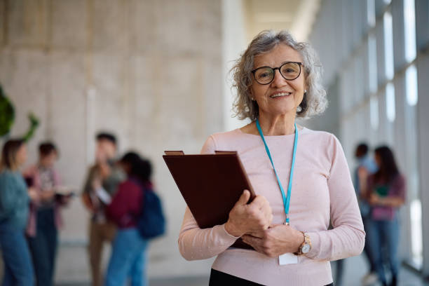 istock Happy mature professor at the university looking at camera. 2198962259