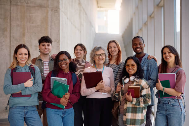 istock Multiracial group of students and their professor at the university looking at camera. 2198962277