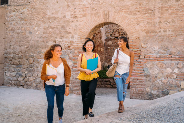 istock University exchange students walking and talking in european city 2198963175