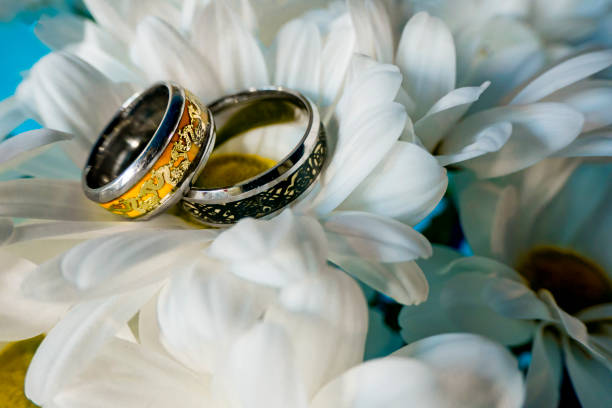 istock Wedding rings surrounded by various wedding details. 2198964158