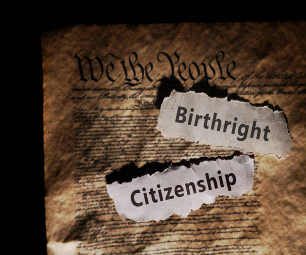 istock Birthright Citizenship newspaper headlines on the US Constitution -- 14th amendment immigration law 2198966693