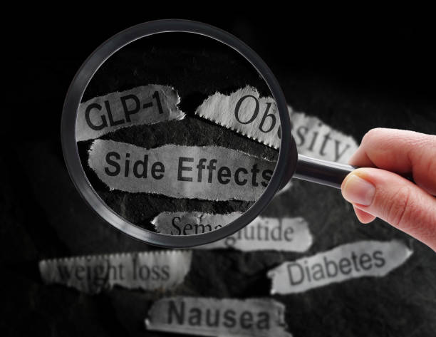 istock GLP-1 and Side Effects newspaper headlines with magnifying glass 2198967300