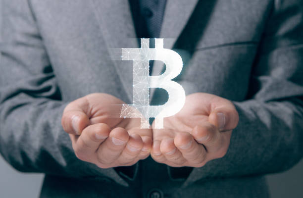 istock bitcoin from the network. cryptocurrency. man holding in his hand 2198967456