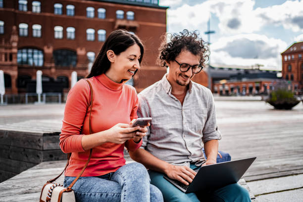 istock Young Couple Using Laptop and Smartphone in Malmo, Sweden 2198967791