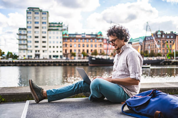 istock Young Man Working Remotely with Laptop in Malmo, Sweden 2198967794