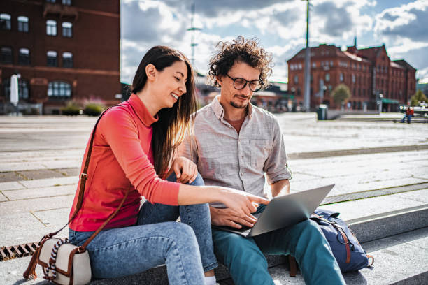 istock Young tourists using laptop and smiling in Malmo, Sweden 2198968313