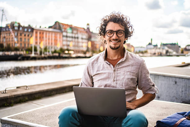 istock Young man working with laptop in Malmo, Sweden 2198968329