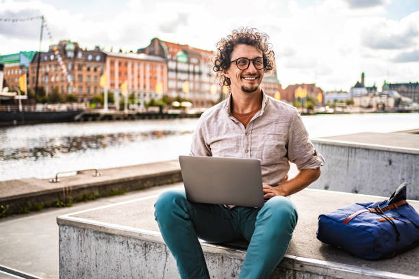 Young Man Working with Laptop in Malmo, Sweden