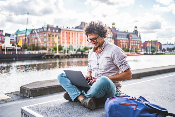 istock Young Man Working on Laptop in Malmo, Sweden 2198968353