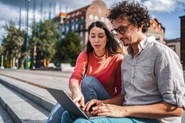 Young colleagues working on a laptop in Malmo, Sweden