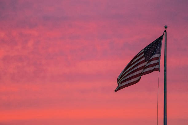 istock An American flag waving in the sunset 2198969857