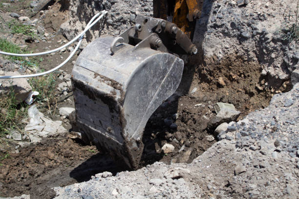 istock Modern excavator digs a trench 2198970352