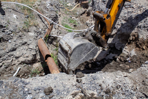 istock Modern excavator digs a trench 2198970358