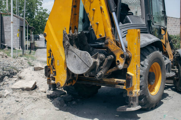 istock Modern excavator stands on the street 2198970378