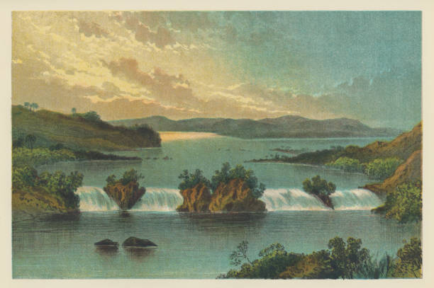 Ripon Falls on Lake Victoria in Uganda, Africa. Vintage etching circa 19th century. The falls were submerged when the Owen Falls Dam was constructed in 1954.