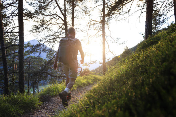 istock Senior man trail hiking in a forest on the Dolomites 2198972082
