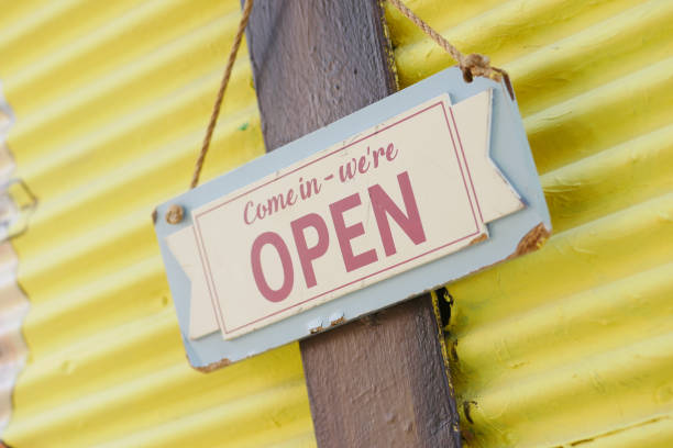 istock Open sign hanging front of cafe . 2198972308