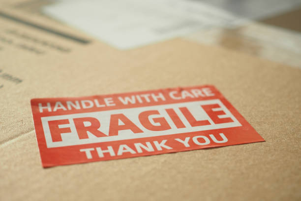 istock A cardboard box marked with a caution label for fragile goods handling during shipping 2198972655