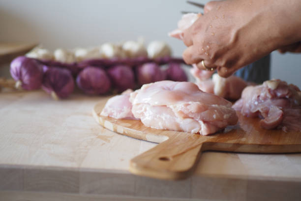 istock Preparing Delicious Chicken Dishes Using Fresh Ingredients Right in Your Kitchen Space 2198972932