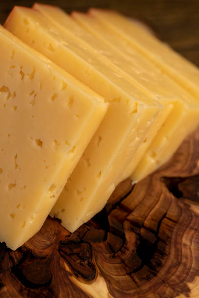 istock hard cheese with holes on the cutting board 2198975860