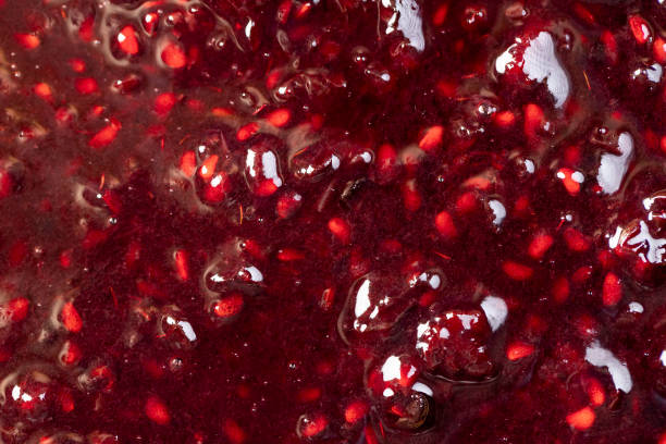 istock Crumpled sweet raspberries with added sugar 2198975866