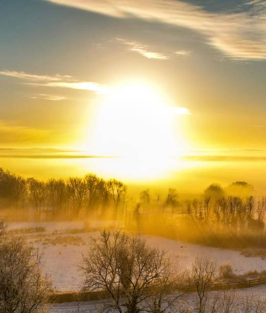 Drone view of the snow and the afternoon sun