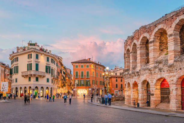 Night view of the Roman Arena and Piazza Bra in Verona, Italy Verona, Italy - May 24 2018: Night view of the Roman Arena and Piazza Bra. The Arena is still in use today and is famous for the large-scale opera performances given there. verona opera stock pictures, royalty-free photos & images