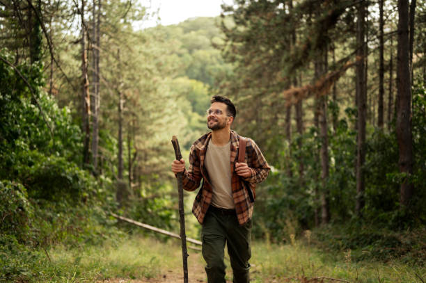 istock Young male walking thought the forrest 2198985923