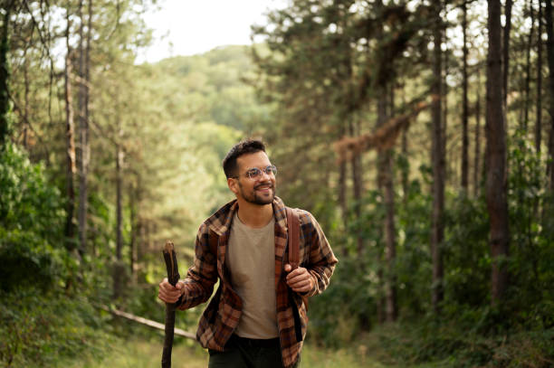 istock Young male walking thought the forrest 2198985975
