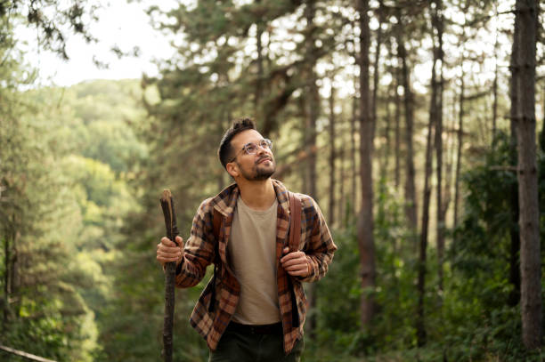 istock Young male walking thought the forrest 2198985990