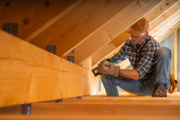 istock A Carpenter Working Diligently in an Attic, Securing Wooden Beams During Home Renovation 2198986210