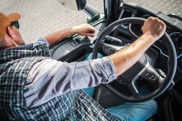 istock Truck Driver Navigating Through a Busy Urban Route During Daytime 2198987117