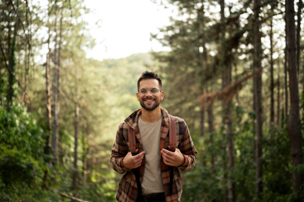 istock Young male walking thought the forrest 2198987624