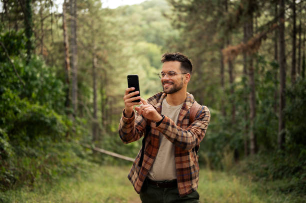 istock Young male walking thought the forrest 2198987632