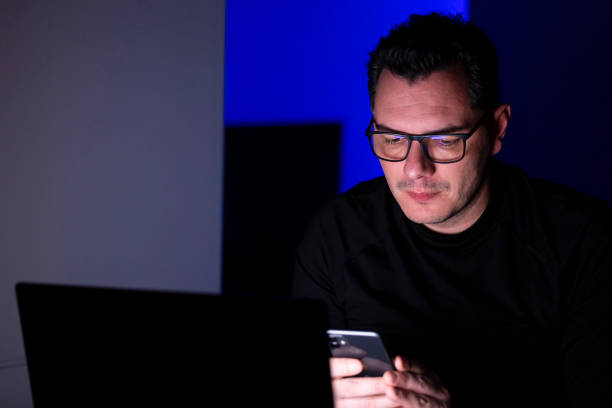 istock Focused Man Working Late at Home 2198987883