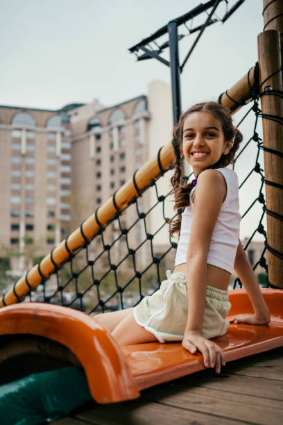 Girl playing in the hotel playground