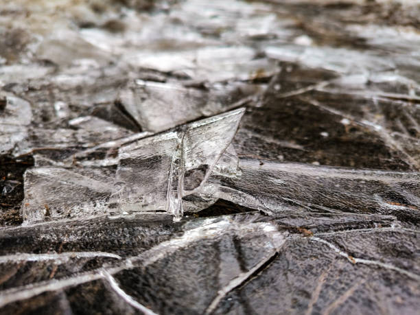 Cracked thin ice in winter after frost. Natural patterns. High quality photo