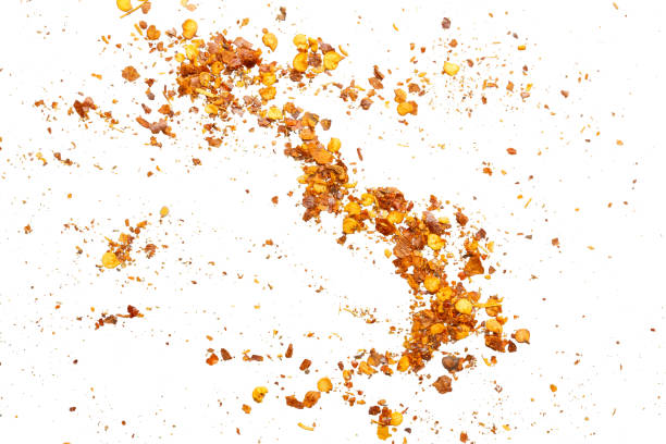 istock dried red chili pepper flakes and seeds isolated on white background 2198990086