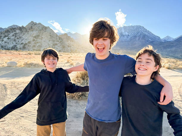 istock Cousins hugging and reuniting in the desert 2198990267