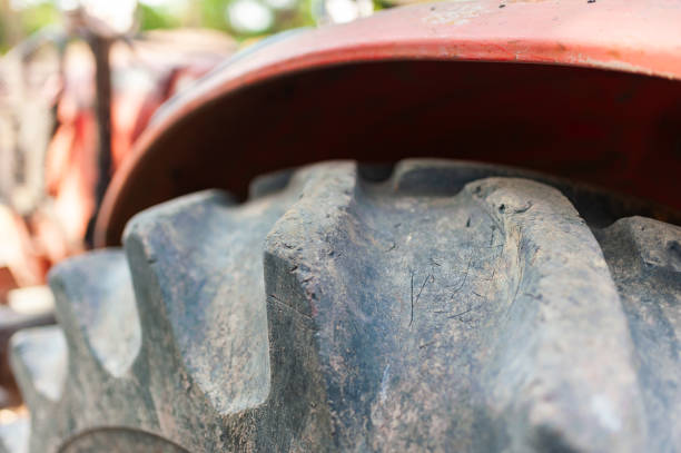 A close-up view of a tractor tire showcases the rugged texture and durability essential for farm work.