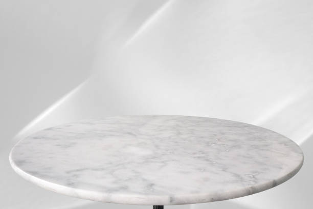 istock Round marble table top with abstract shadow drop on white wall background for mockup product display 2199004846