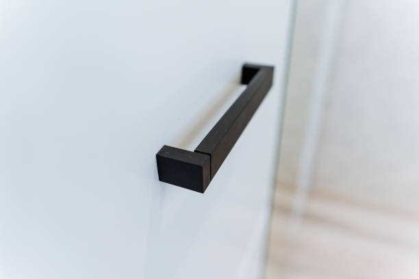 istock This closeup image showcases a stylish black handle against a white wall, highlighting its innovative design and intricate texture that captivates the viewers attention 2199005814