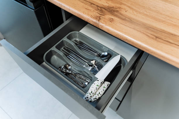 istock This modern kitchen drawer features a stylish and efficient cutlery organizer that is specifically designed to hold forks, knives, and spoons, keeping your kitchen neat and tidy 2199005828